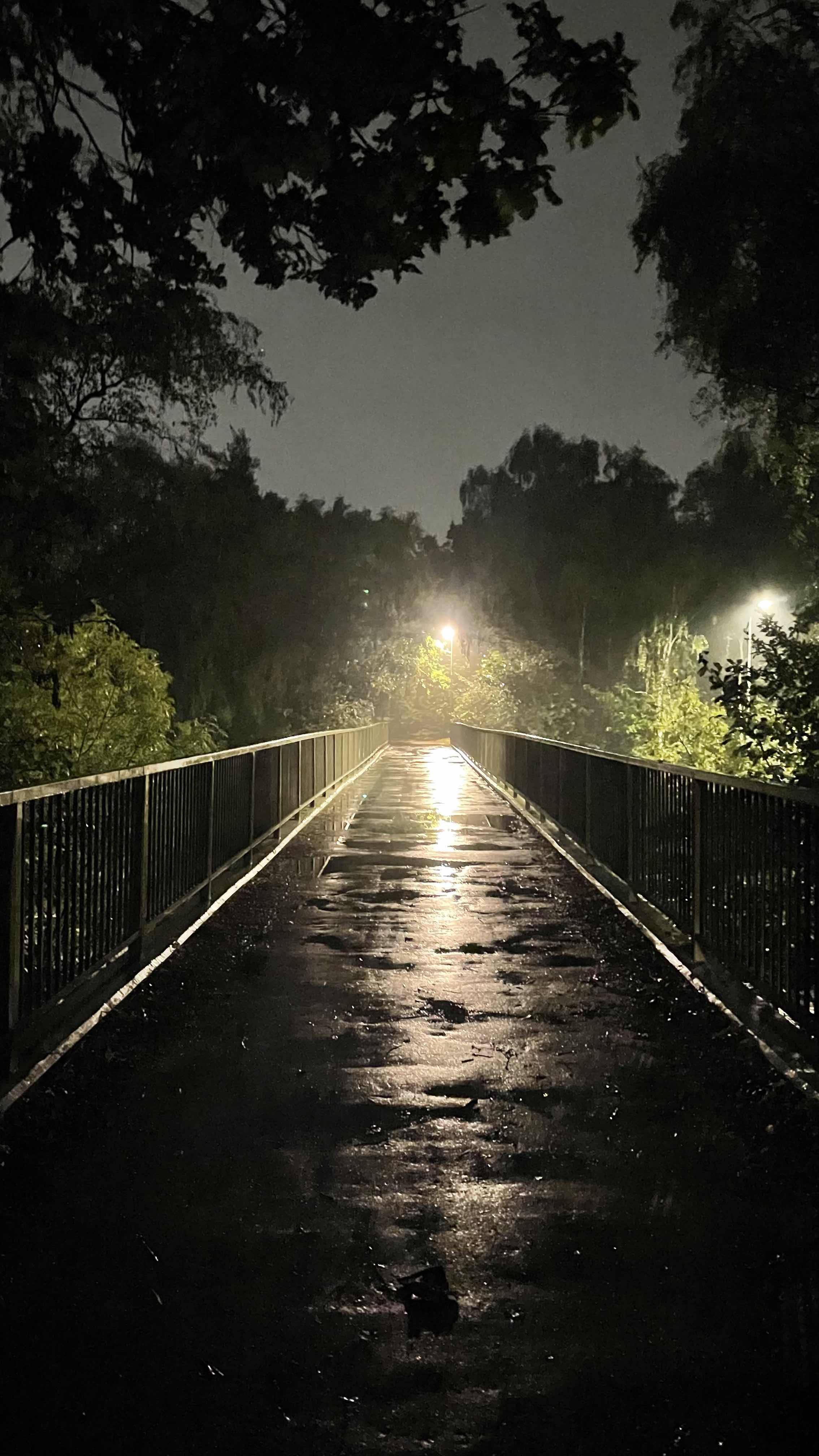 rainy bridge with light at the end